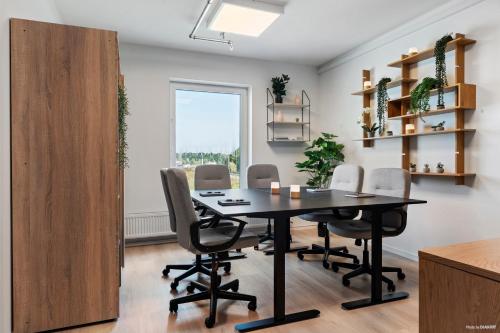 a dining room with a table and chairs at Aiden by Best Western Odense in Odense