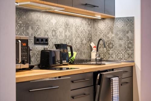 a kitchen with a sink and a counter top at MátraForRest in Mátraszentistván