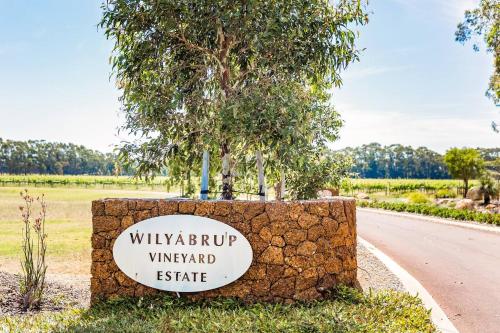 a sign for the wijayaup vineyard estate next to a road at Bonnie and Piper - Lakeside and Wine Country Living in Wilyabrup
