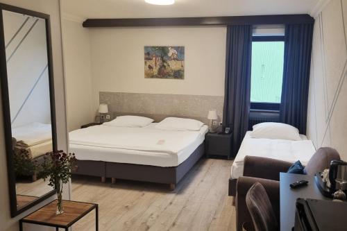 Ένα ή περισσότερα κρεβάτια σε δωμάτιο στο Mercure Hotel Ingolstadt