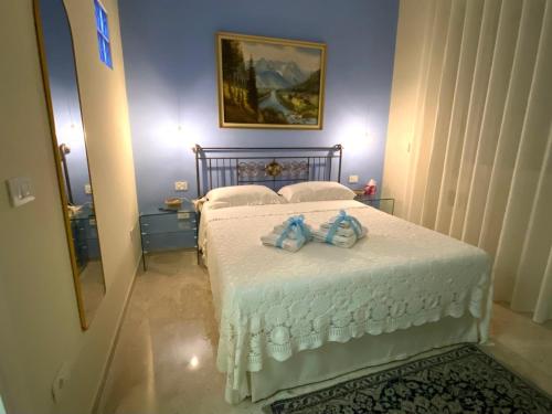 a bedroom with a bed with two towels on it at Luxury B&B La casa sul mare in Taranto