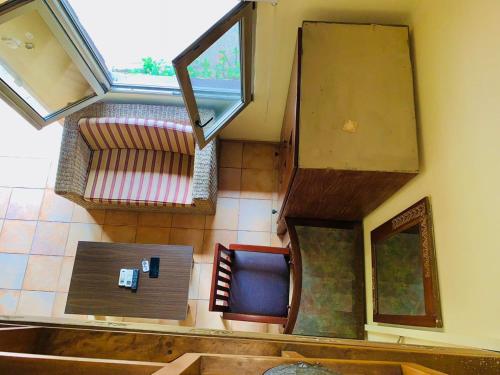 an overhead view of a room with a table and a window at Accra City Studios & Apartment in Accra