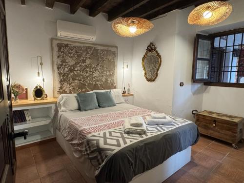 Giường trong phòng chung tại Casa Patio Corduba