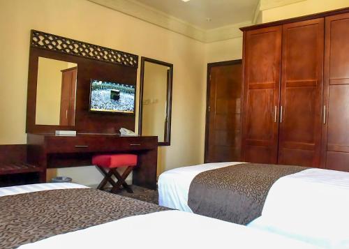 Katil atau katil-katil dalam bilik di Procare Apart hotel