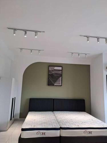 Postel nebo postele na pokoji v ubytování Studio, Youth City Residence, Nilai