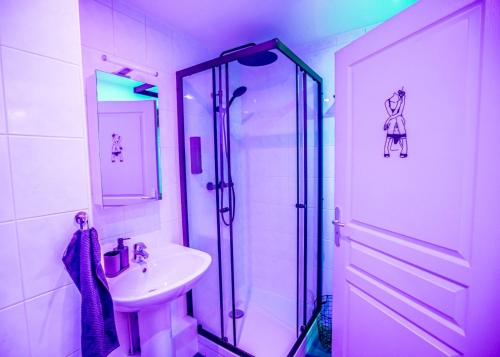 a white bathroom with a shower and a sink at PRoJET KUROI - Love Room BDSM - Balançoire, Banc de fessée, Cage, Croix, Tantra in Walbourg