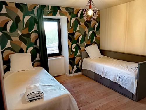 Llit o llits en una habitació de La Canopée