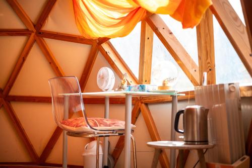 a room with two chairs and a table in a attic at Centre Harmonia in Rennes-les-Bains