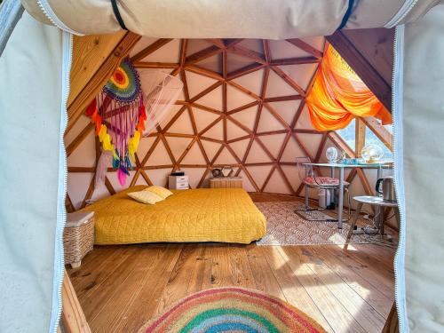 a room with a bed in a yurt at Centre Harmonia in Rennes-les-Bains