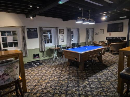 a billiard room with a pool table in it at The Bull Hotel in Downton