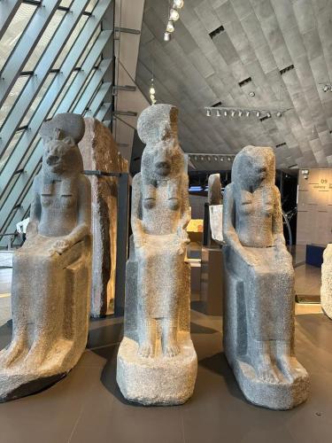 two cement statues on display in a museum at Happy Day Pyramids View Hotel in Cairo