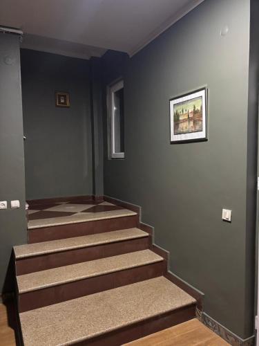 a room with stairs with a painting on the wall at HOTEL Mare in Ureki