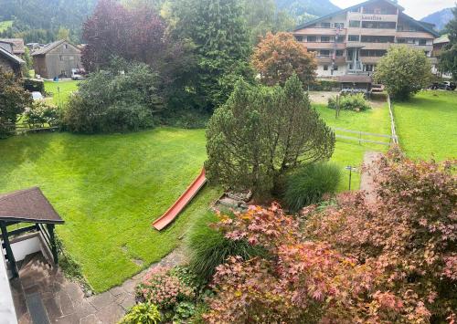 an aerial view of a yard with a playground at Mellau Appartments 220 in Mellau