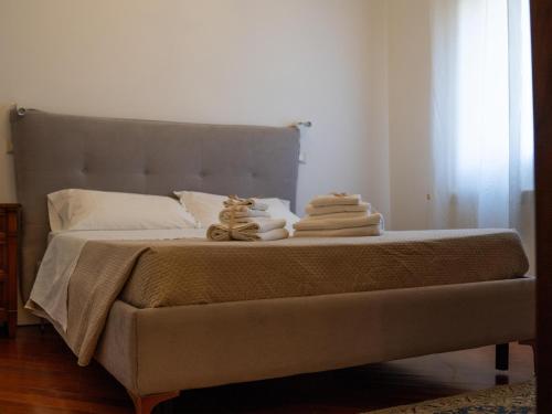 a bedroom with a bed with towels on it at B&B Estea Tropea in Tropea