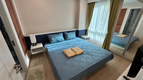 Postel nebo postele na pokoji v ubytování Seven Seas Resort - Jomtien Beach