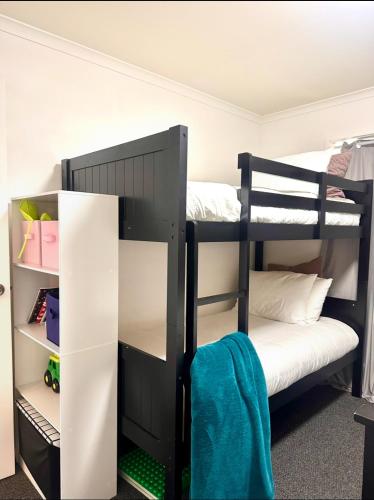 a bunk bed room with two bunk beds in it at Sunny Shackell - Echuca Moama Holiday Accommodation in Echuca
