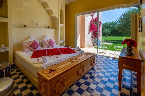 a bedroom with a large bed with a large window at Palais pyar in Najem