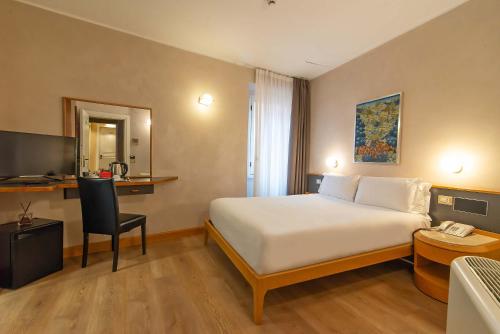 En eller flere senge i et værelse på Hotel Accademia