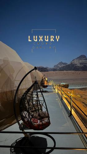a wire basket hanging from the roof of a vehicle at RUM CROWD DARLiNG LUXURY in Wadi Rum