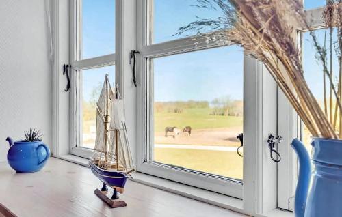 a room with a window with a view of a field at Timber-Frame Holiday Flat Near Beach in Vålse