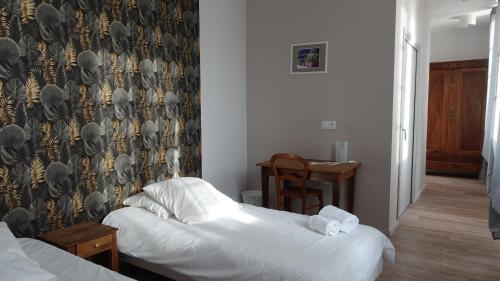 Katil atau katil-katil dalam bilik di Hostelleire du couvent