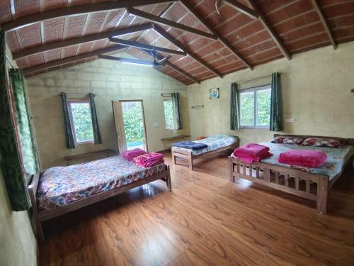 Postel nebo postele na pokoji v ubytování Prakruthi Farmstay