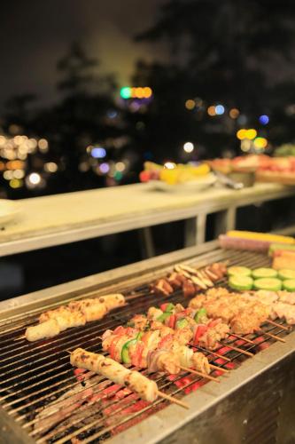 a grill with many different types of food on it at Sapa Succulent Garden Homestay in Sa Pa