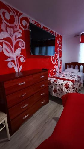 Una cama o camas en una habitación de Hotel D'Gloria Churin