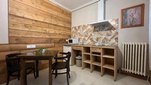 Kuchyň nebo kuchyňský kout v ubytování Hostal Ochoa
