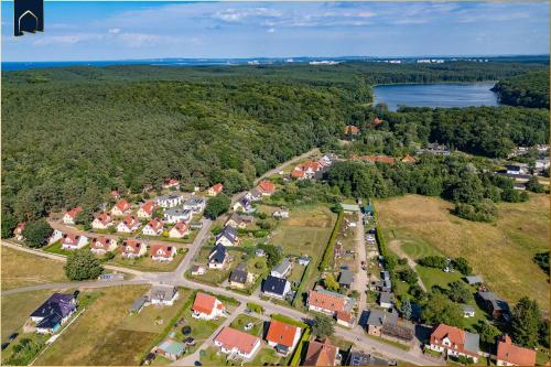 an aerial view of a small town with houses at Waldsiedlung Waldhaus App 2.2 in Korswandt