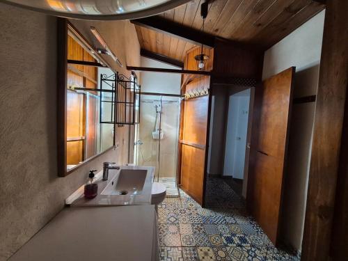 a bathroom with a sink and a mirror and a shower at Welcome to your rural retreat, Casita Canaria III in La Sabinita