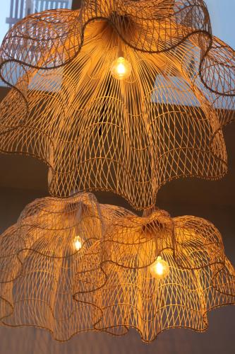 a close up of a light fixture with umbrellas at SEASENSE Boutique Beach Villa in Wilderness