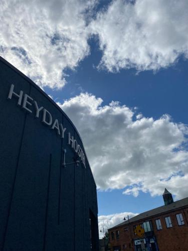 a sign on the side of a building at Heyday Hostel Ballina in Ballina