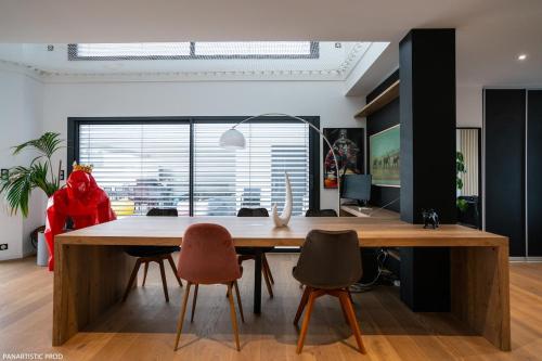 an office with a large wooden table and chairs at Villa "Colmar" Spa and Free vine test in Raedersheim