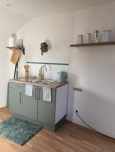 Una cocina o cocineta en L'instant Cocooning