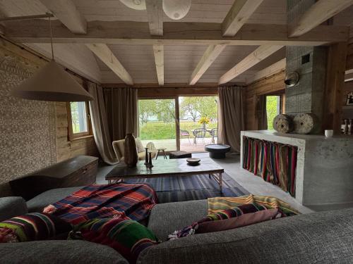 a living room with a couch and a table at Dom w sadzie 