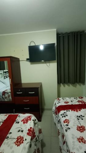 Una cama o camas en una habitación de Hotel D'Gloria Churin