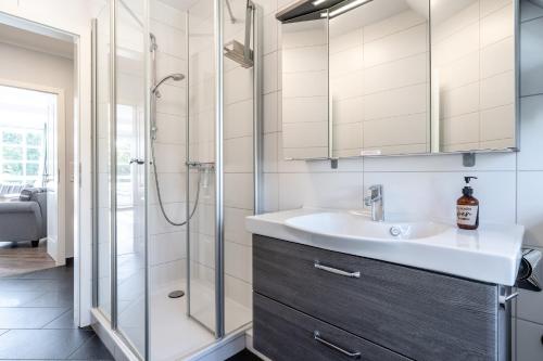 a bathroom with a sink and a shower at Rungholt in Ording