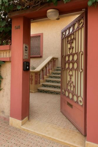 an entrance to a building with a door with stairs at Marrakech Villa Floor Private Garden & Sport Space in Oulad Akkou