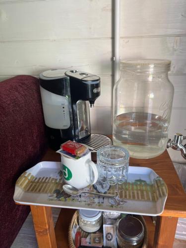 a tray with a coffee maker on a table at 29 Park Avenue , Shoreham-by-Sea , Cozy Cabin in Shoreham-by-Sea