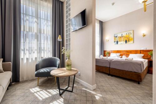 Postel nebo postele na pokoji v ubytování Hotel Piast Wrocław Centrum
