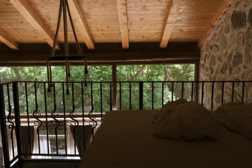 a room with a table and a screened in porch at Kompleks Etno Luks in Crvulevo