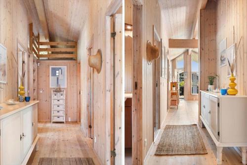 a kitchen with wooden walls and wooden flooring at HA385-Hals-Sonder-Havsig-8 in Hou