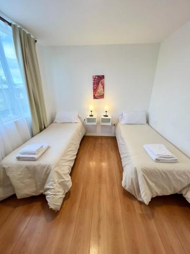 Letto o letti in una camera di Amplio departamento renovado en el centro de la ciudad