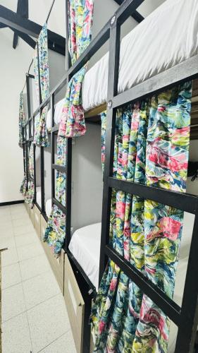 a row of bunk beds in a dorm room at Baku Laureles Hostel in Medellín