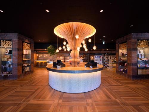 a large room with a counter with a large mushroom at Urabandai Lake Resort Goshiki no Mori in Kitashiobara