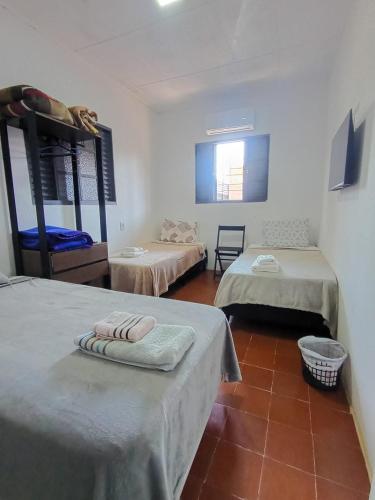 a room with two bunk beds and a tile floor at New hotel in Alegrete