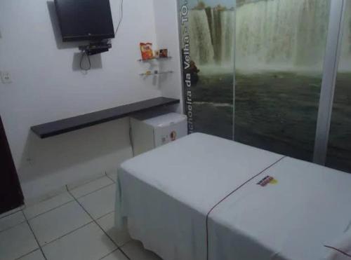 En eller flere senge i et værelse på Colorado Hotel