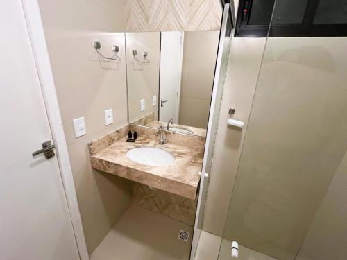 a bathroom with a sink and a shower at Arrey Express Hotel - Picos in Picos