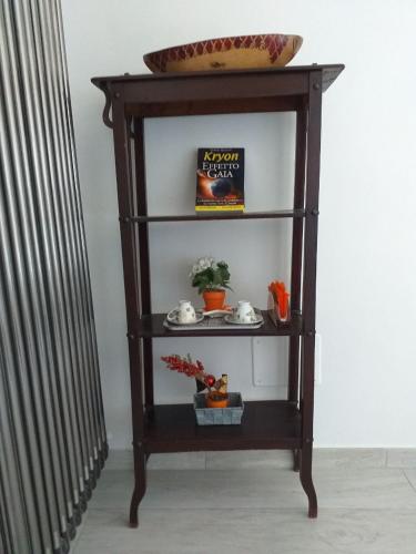 a shelf with a bowl on top of it at Holiday GN in Lastra a Signa